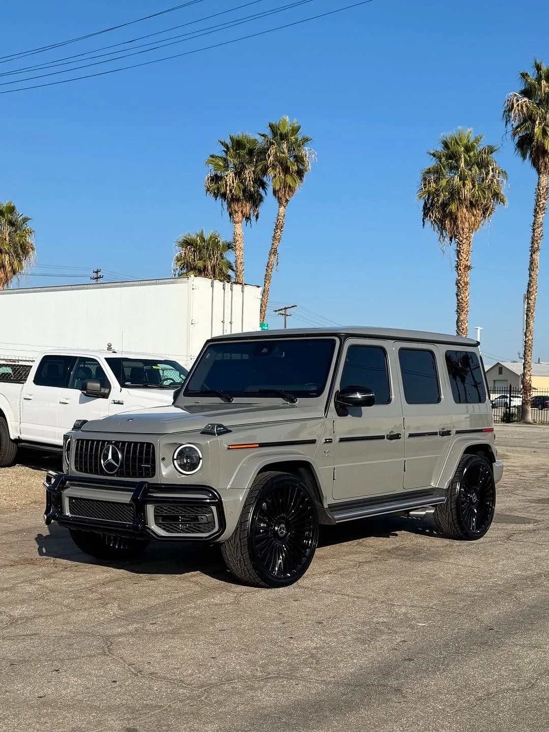 Casual phone photo of a gray Mercedes G-Class