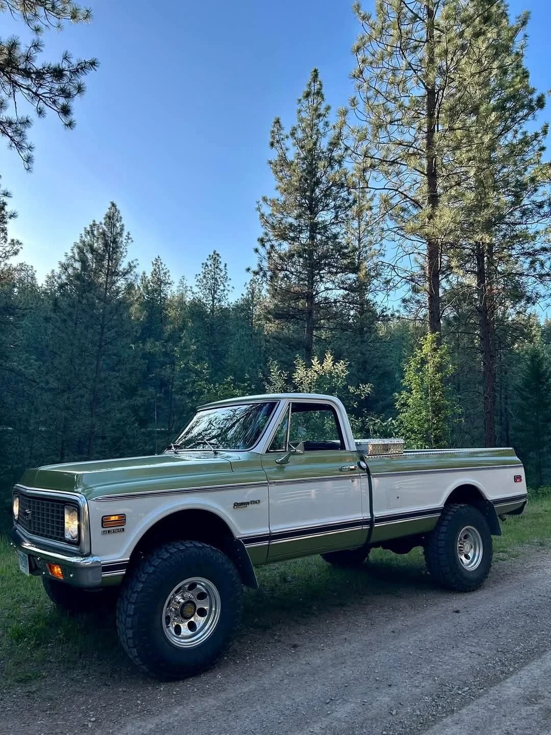 Phone photo of a vintage green pickup