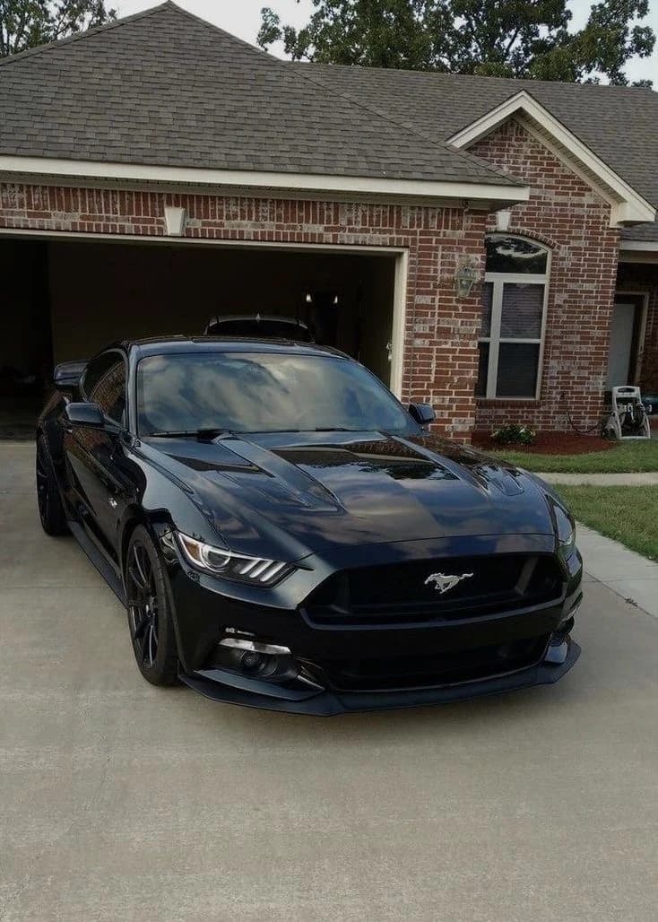Phone photo of a black Ford Mustang
