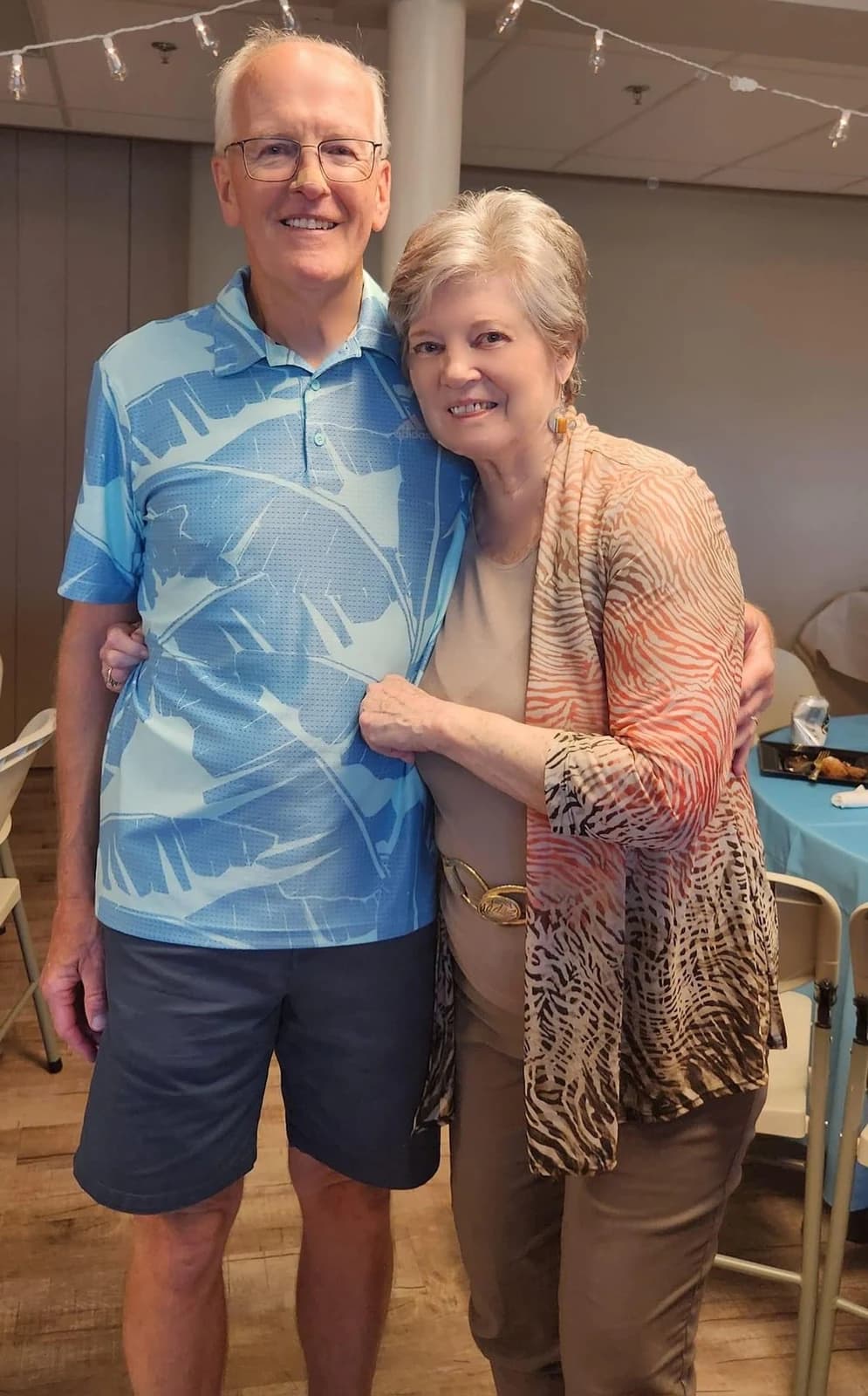 Casual phone photo of a smiling older couple