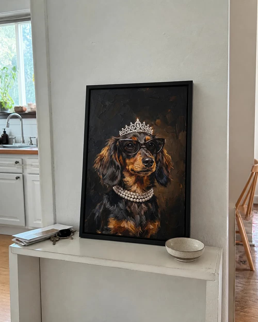 Sample phone photo of a framed Dachshund portrait on a kitchen console